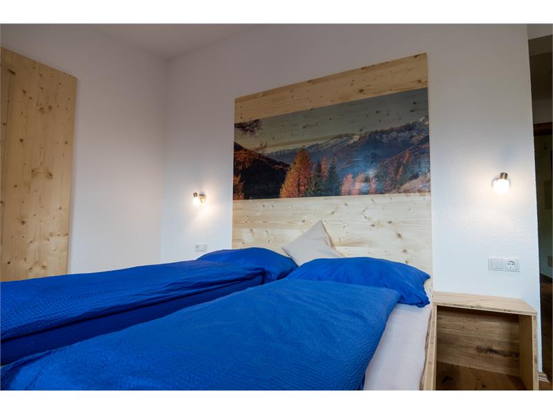 Appartamento Wald/Boschetto: camera da letto