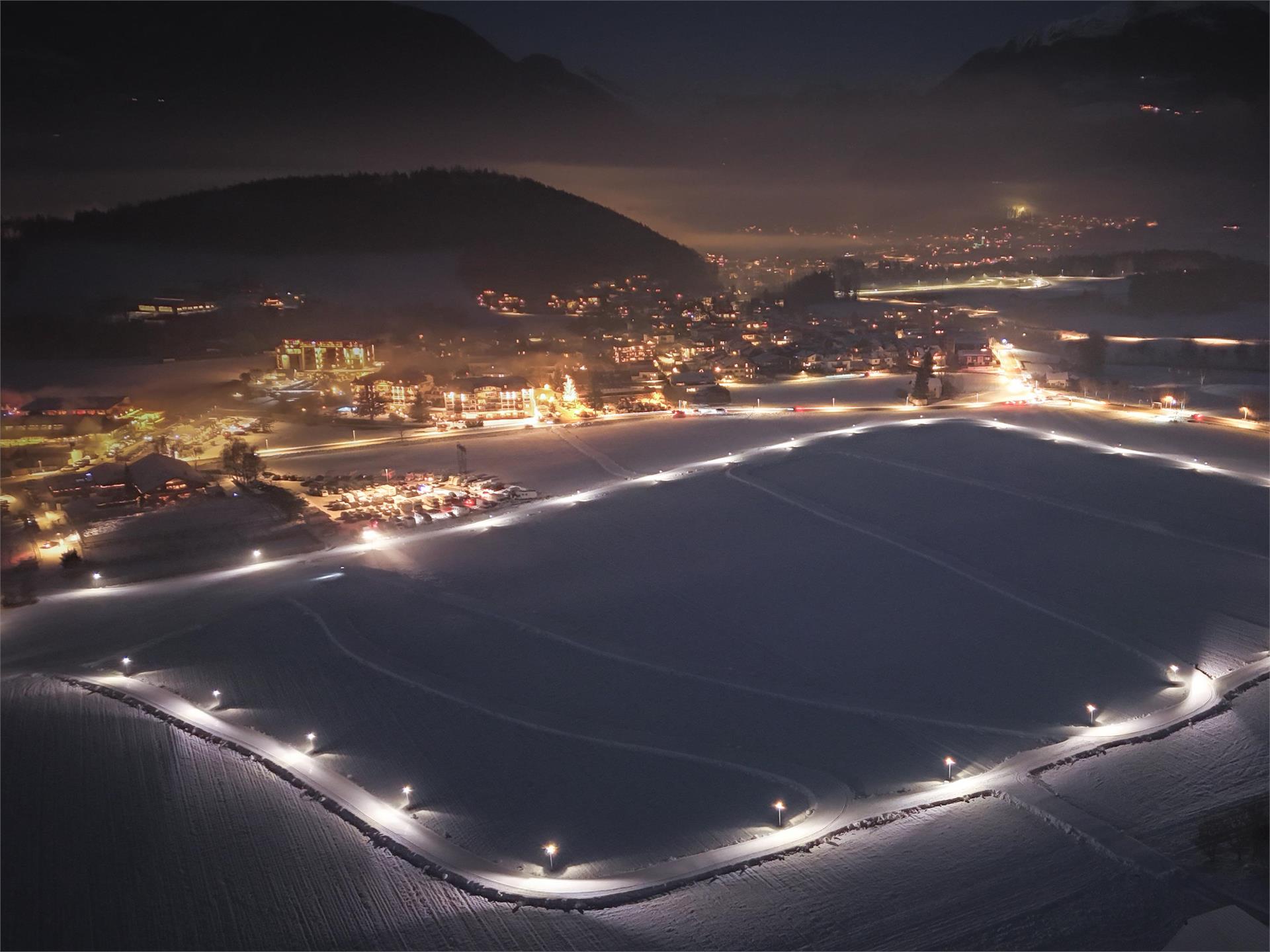 Cross-country skiing in the evening in Reischach