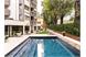 Flora Hotel & Suites - Heated outdoor swimmingpool in the mediterrean garden