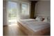 Zimmer Ferienwohnung mit Bett in Zirmholz massiv