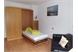 Wohnzimmer mit Schlafgelegenzeit im Appartement Alpenrose